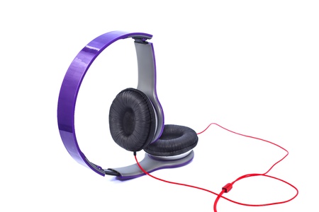 Purple headphones isolated on a white backgroundの写真素材