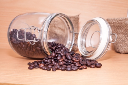 coffee beans in a bottle on deckの写真素材