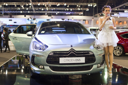 NONTHABURI - DECEMBER 6   Unidentified model with Citroen DS5 car on display at The 30th Thailand International Motor Expo on December 6, 2013 in Nonthaburi, Thailand のeditorial素材