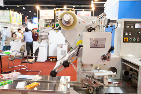 BANGKOK, THAILAND - February 3:The machine food wrapping in Thailand Industrial fair 2014 and Food...