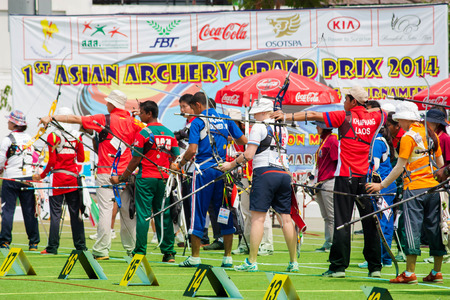 BANGKOK ,THAILAND - MARCH 15: Unidentified archers in a row start to shoot . At 1st Asian Archery 
Grand Prix 2014  , on March 15, 2014 in Bangkok, Thailand.のeditorial素材