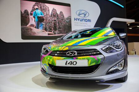 NONTHABURI - March 26  Unidentified modellings posted over Hyundai Tucson  display on stage at The 35th Bangkok International Motor Show on March 26, 2014 in Nonthaburi, Thailand のeditorial素材