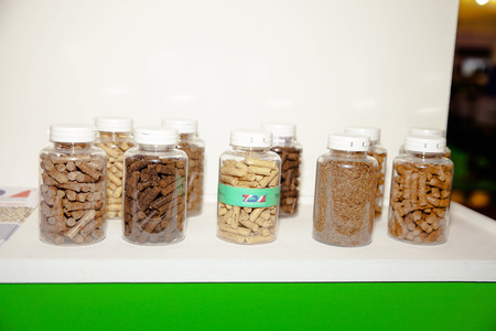 BANGKOK - JUNE 4   close up image of natural wood pellet in bottle at Renewable Energy Environmental Technology on June 4,2014 in BITEC ,Bangkok, Thailand のeditorial素材