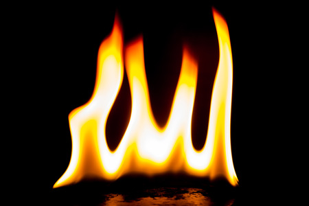 Fire flames on a black backgroundの写真素材