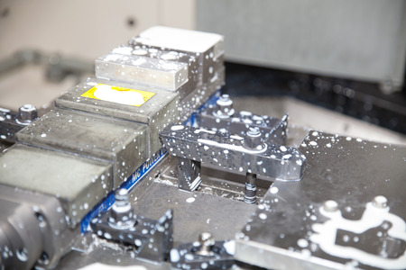 BANGKOK - JUNE 22   metal blank with cooling liquid  at Manufacturing Expo 2014 on June 22,2014 ,Bangkok, Thailand のeditorial素材