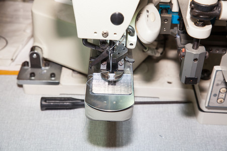 BANGKOK - JUNE 28 :Auto sewing buttons machine at Garment Manufacturers Sourcing 2014 on June 28,2014 in BITEC ,Bangkok, Thailand.のeditorial素材