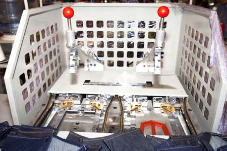 BANGKOK - JUNE 28  cutting jean back pocket machine at Garment Manufacturers Sourcing 2014 on June 28,2014 in BITEC ,Bangkok, Thailand のeditorial素材