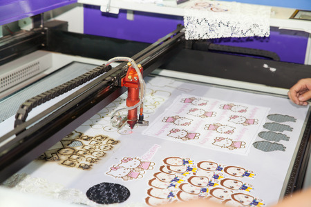 BANGKOK - JUNE 28  Laser cutting on fabric at Garment Manufacturers Sourcing 2014 on June 28,2014 in BITEC ,Bangkok, Thailand のeditorial素材