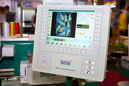 BANGKOK - JUNE 28  Embroidery controller at Garment Manufacturers Sourcing 2014 on June 28,2014 in BITEC ,Bangkok, Thailand のeditorial素材
