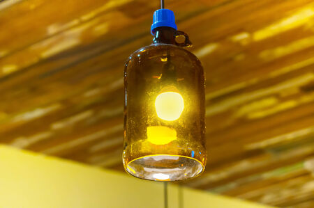 idea concept with light bulbs on a orange backgroundの写真素材