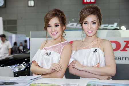BANGKOK - AUGUST 16 :An unidentified female presenter models at HONDA booth at Big Motor Sale 2014 on June 16,2014 in BITEC ,Bangkok, Thailand.のeditorial素材