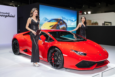 BANGKOK - AUGUST 16 :An unidentified female presenter models at Lamborghini booth at Big Motor Sale 2014 on June 16,2014 in BITEC ,Bangkok, Thailand.のeditorial素材