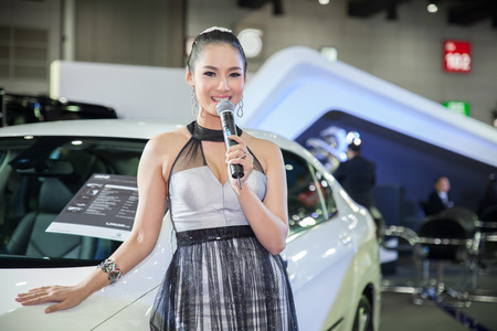 BANGKOK - AUGUST 16 :An unidentified female presenter models at PEUGEOT Motor booth at Big Motor Sale 2014 on June 16,2014 in BITEC ,Bangkok, Thailand.のeditorial素材