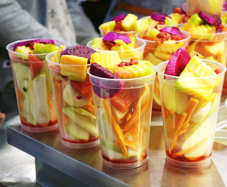 fruit mixed cocktail in cupsの写真素材