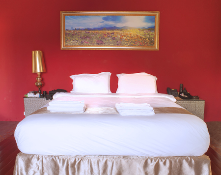 Bedroom decorated in red wallのeditorial素材