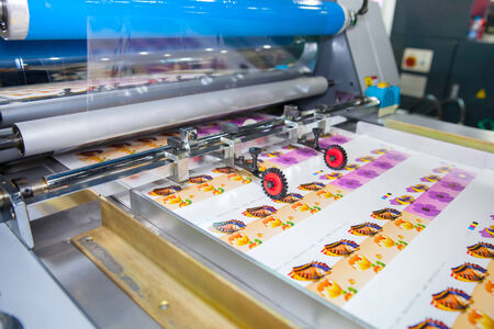 BANGKOK - SEPTEMBER 27 :Plastic coating on paper machines display at GASMA PRINT 2014 on Sep 27,2014 in BITEC ,Bangkok, Thailand.のeditorial素材