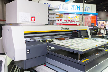 BANGKOK - SEPTEMBER 27 :MIMAKI curing flatbed inkjet at GASMA 
PRINT 2014 on Sep 27,2014 in BITEC ,Bangkok, Thailand.のeditorial素材