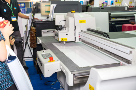 BANGKOK - SEPTEMBER 27 :Drawing and cutting machines at GASMA PRINT 2014 on Sep 27,2014 in BITEC ,Bangkok, Thailand.のeditorial素材