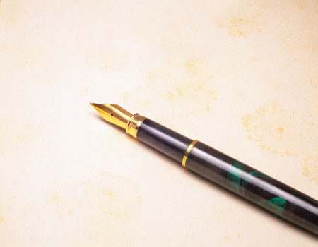 Vintage Fountain Pen on old book backgroundの写真素材