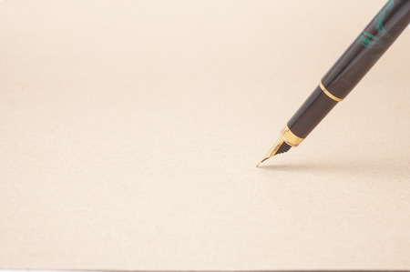 Vintage Fountain Pen on old paper backgroundの写真素材