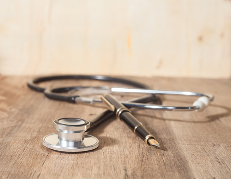Stethoscope on wooden backgroundの写真素材