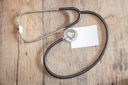 Stethoscope on wooden backgroundの写真素材