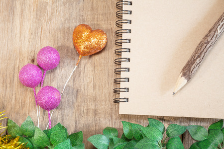 Blank textbook and pencil on white hardwood desk.の写真素材