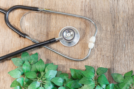 Stethoscope on wooden backgroundの写真素材