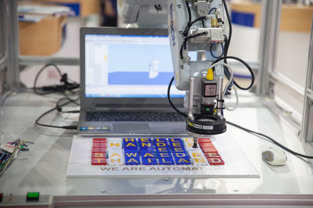 BANGKOK - NOVEMBER 22 :An industrial robot hands display at METALEX 2014 on Nov 22,2014 in BITEC ,Bangkok, Thailand.のeditorial素材
