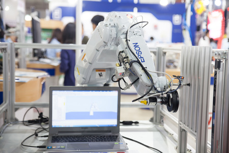 BANGKOK - NOVEMBER 22 :An industrial robot hands display at METALEX 2014 on Nov 22,2014 in BITEC ,Bangkok, Thailand.のeditorial素材