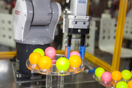 BANGKOK - NOVEMBER 22 :An industrial robot hands display at METALEX 2014 on Nov 22,2014 in BITEC ,Bangkok, Thailand.のeditorial素材