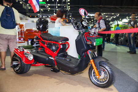 NONTHABURI - DESEMBER 4 :UDA  Eletric scooter motorcycle on display at MOTOR EXPO 2014 on Dec 4,2014 in Nonthaburi, Thailand.のeditorial素材