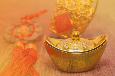 Chinese New Year Ornament--Gold ingots on gold color themeの写真素材