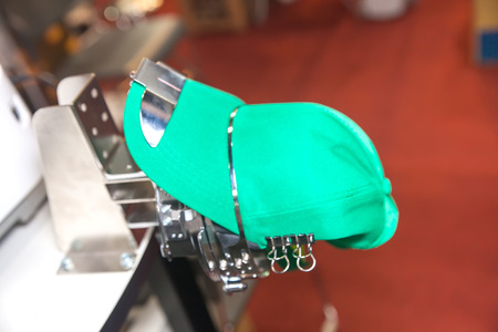 BANGKOK ,THAILAND - FEBRUARY 7: Cap on embroidery machine at THAILAND Industrial Fair 2015 And Food Pack Asia 2015 on February 7, 2015 in Bangkok, Thailand.のeditorial素材