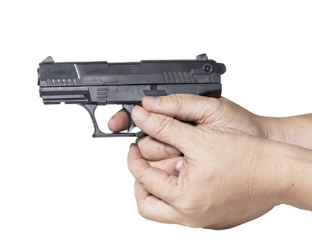 hand holds gun isolated on white background.