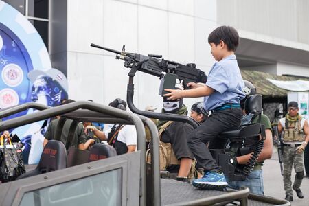 BANGKOK ,THAILAND - JULY 18: Unidentified actor show action with 
light armored vehicle in Engineering Expo 2015 , on JULY 18, 2015 
in Bangkok, Thailand.のeditorial素材