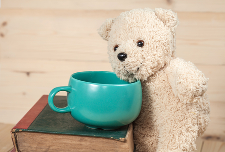 bear toy with cup of coffeeの写真素材
