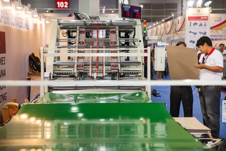 BANGKOK - AUGUST 29 :cutting paper hard board machine at Pack Print and T-PLAS THAILAND on Aug 29,2015 in BITEC ,Bangkok, Thailand.のeditorial素材