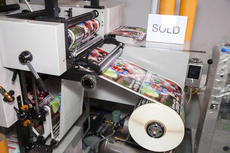 BANGKOK - AUGUST 29 :Roll of print paper machine at Pack Print and T-PLAS THAILAND on Aug 29,2015 in BITEC ,Bangkok, Thailand.のeditorial素材