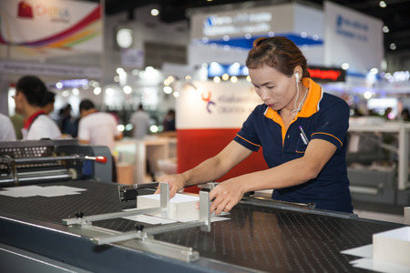 BANGKOK - AUGUST 29 :Unidentified people setting with   paper box on machine at Pack Print and...
