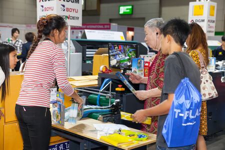 BANGKOK - AUGUST 29 :Unidentified people interesting with  printing on paper box  at Pack Print and T-PLAS THAILAND on Aug 29,2015 in BITEC ,Bangkok, Thailand.のeditorial素材