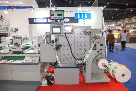BANGKOK - AUGUST 29 :printting on sticker roll machine at Pack Print and T-PLAS THAILAND on Aug...