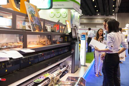 BANGKOK - AUGUST 29 :Unidentified people interesting with digital printing machine at Pack Print...