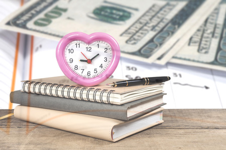 stack of books and an alarm clock