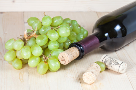 green grape and wine bottleの写真素材