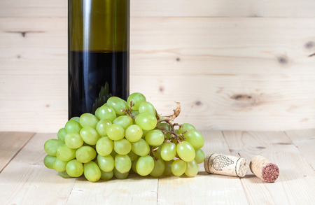 green grape and wine bottleの写真素材