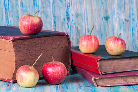 Red apple on old bookの写真素材