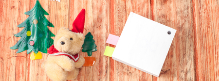 Christmas decoration and bear toy on woodの写真素材