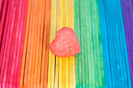 heart candies coated with sugar sitting on colourful table.selective focus.の写真素材