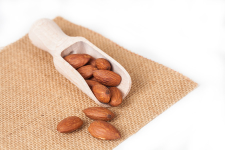 almonds in wood spoonの写真素材